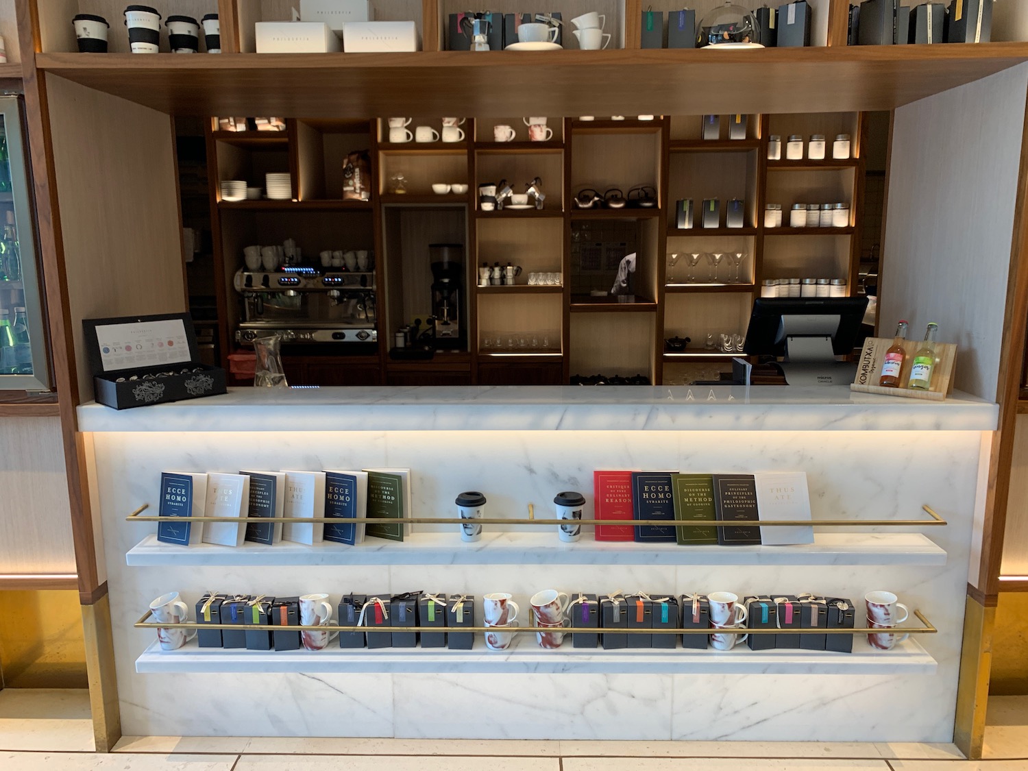 a counter with a variety of coffee mugs on it