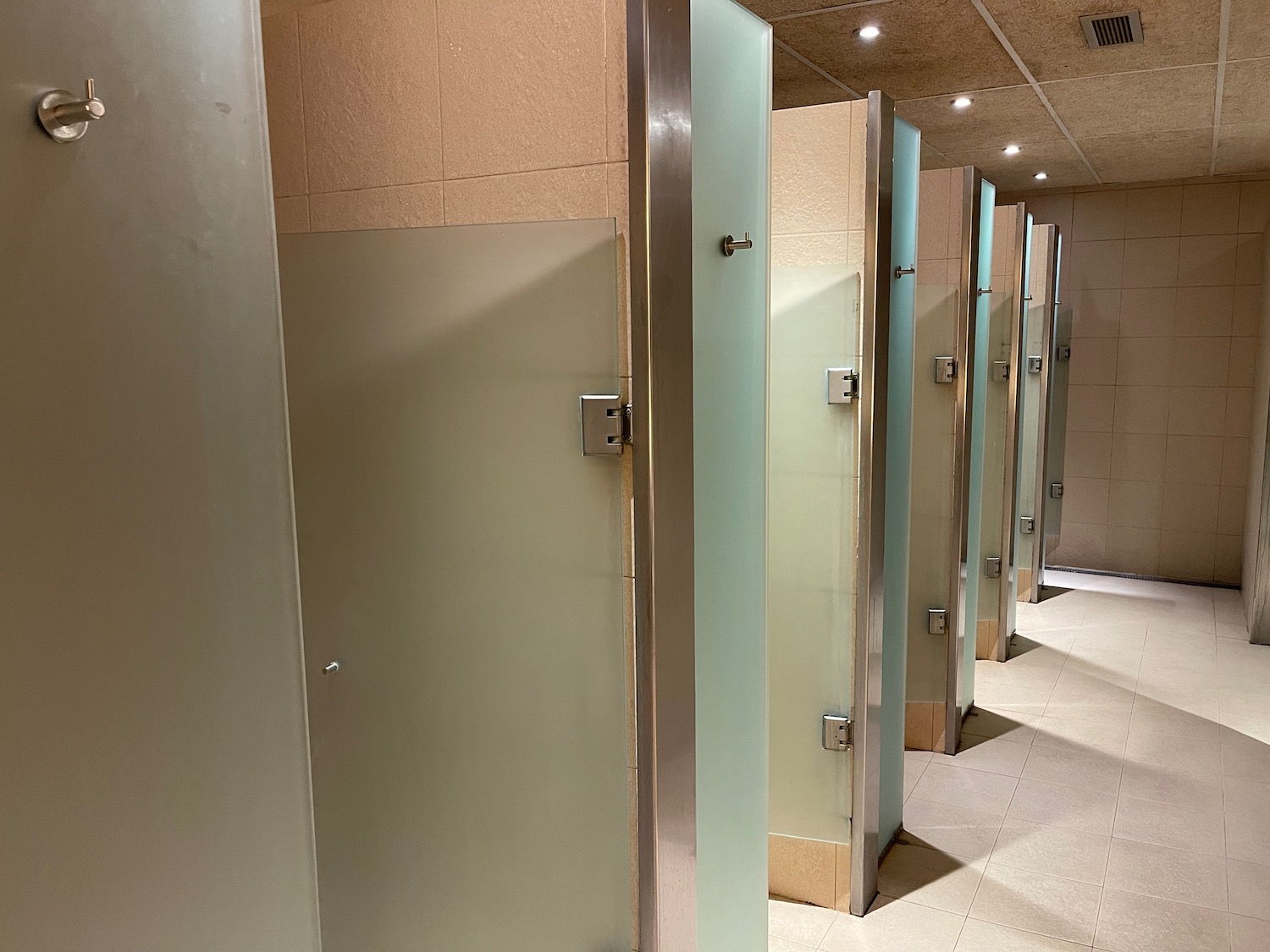 a row of doors in a bathroom