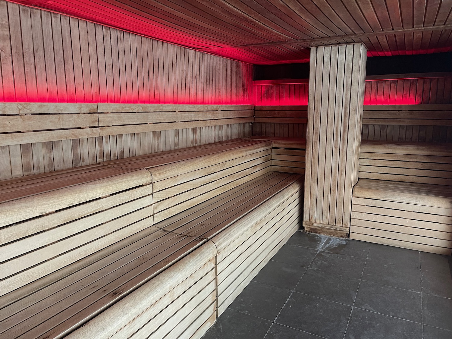 a wooden sauna with red lights