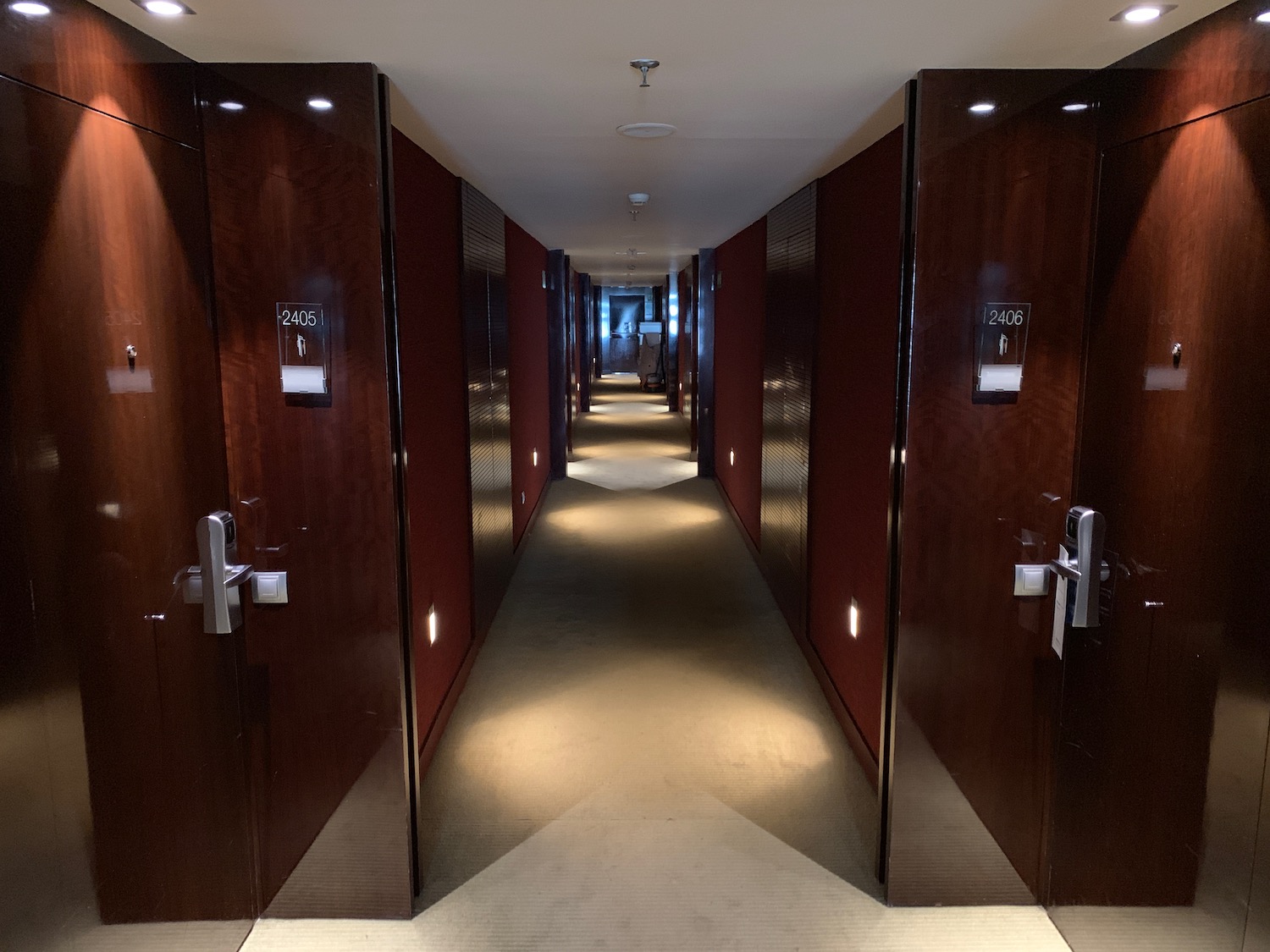 a hallway with doors and lights