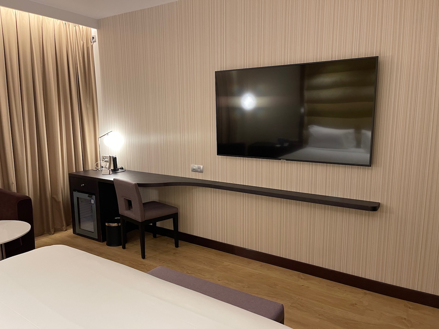 a room with a television on the wall