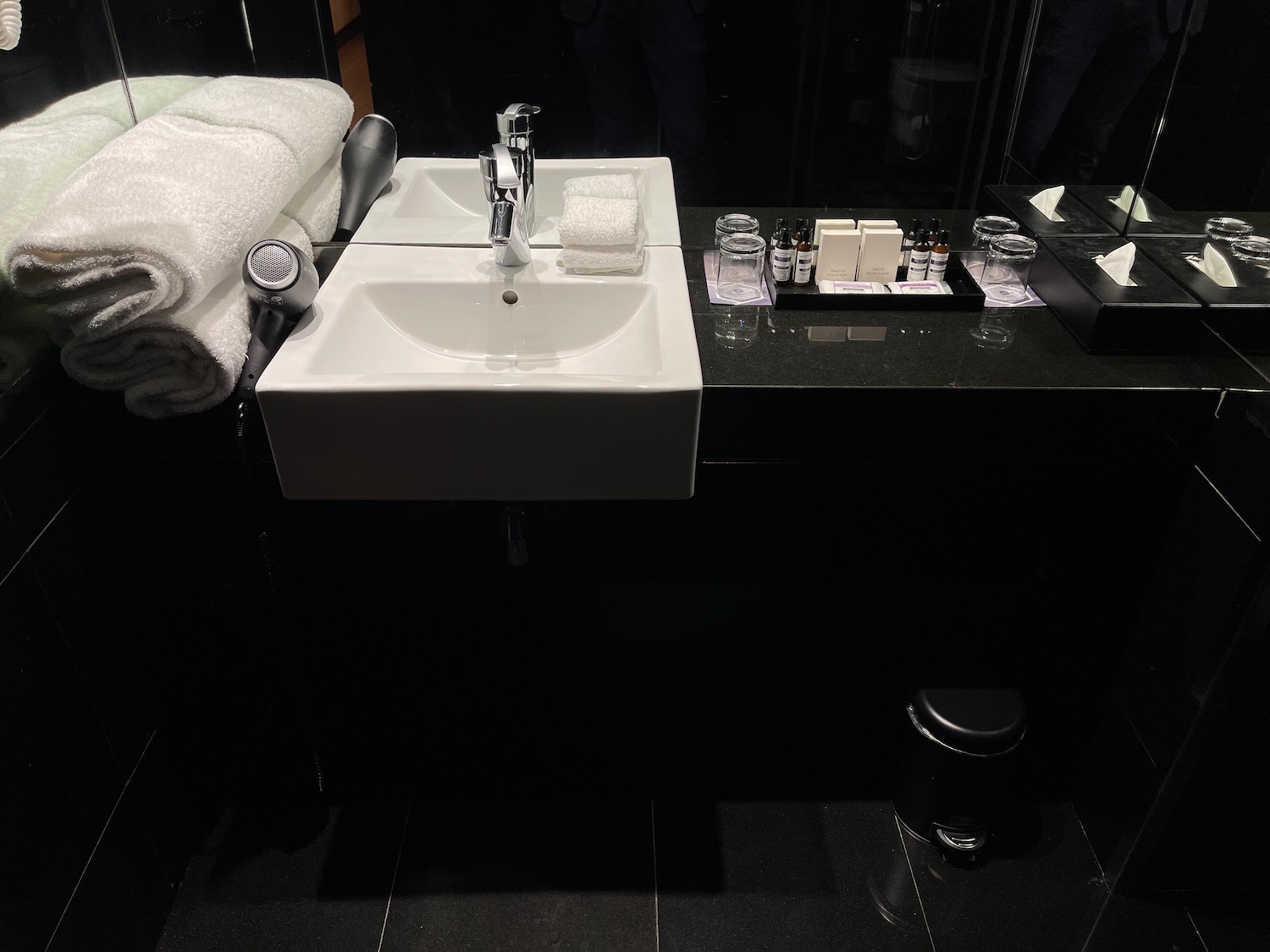 a sink and towels in a bathroom