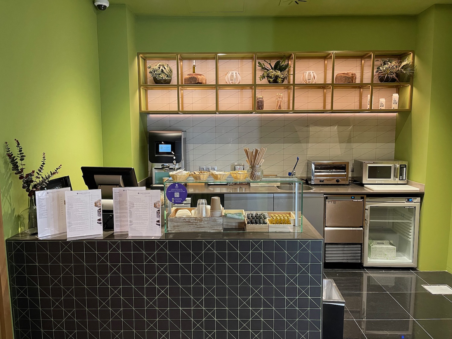 a kitchen with a counter and shelves