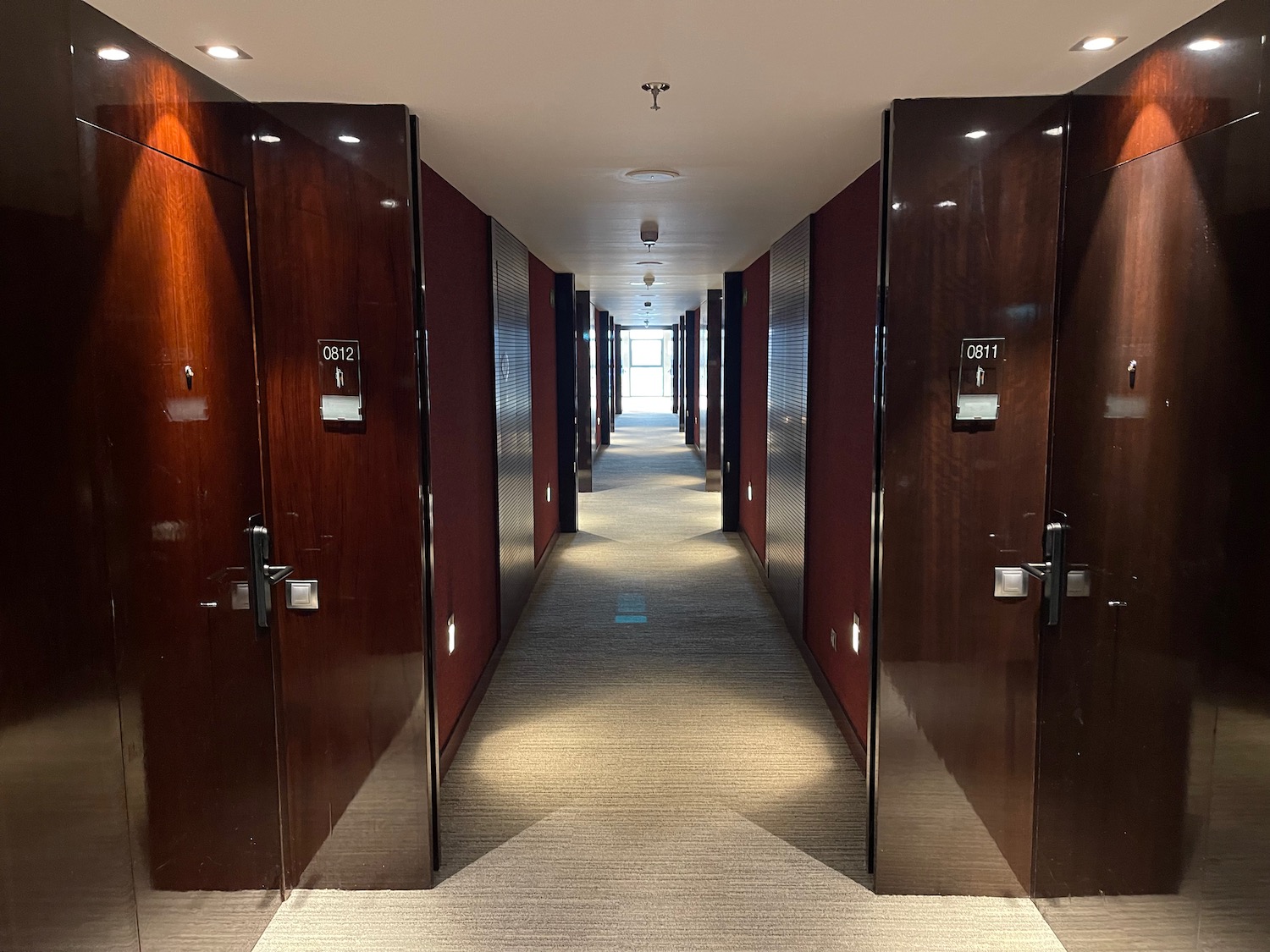 a hallway with doors and lights