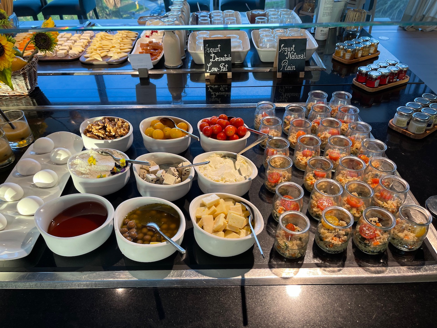 a buffet table with food in containers