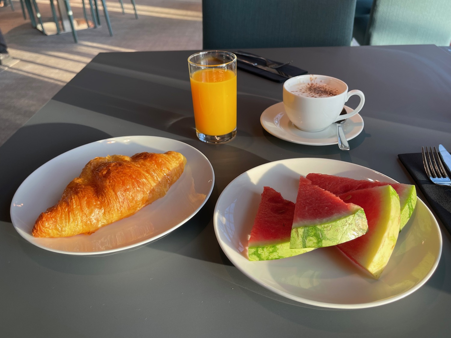 a plate of food and a cup of coffee on a table