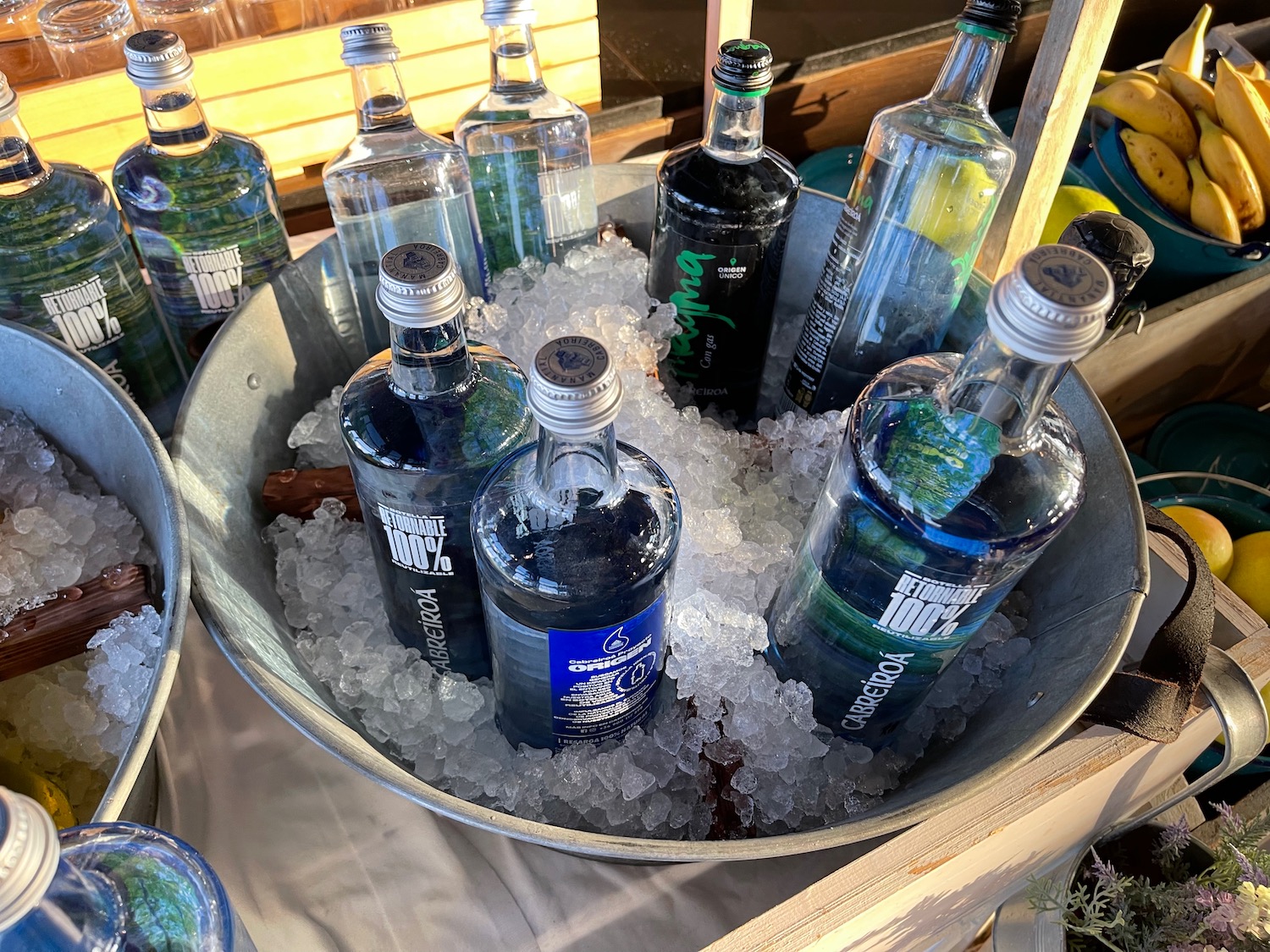 a bucket of bottles of liquid