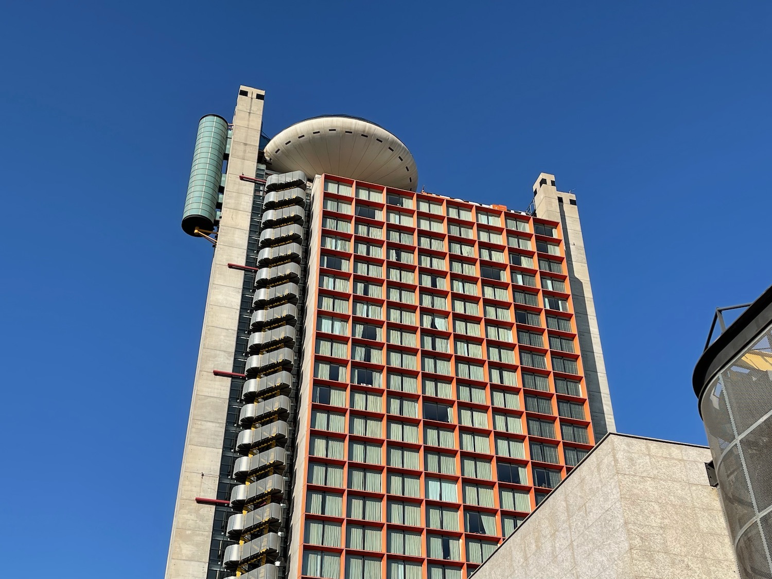 a tall building with a round object on top
