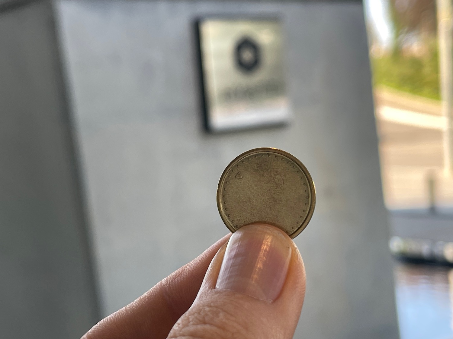 a person holding a coin