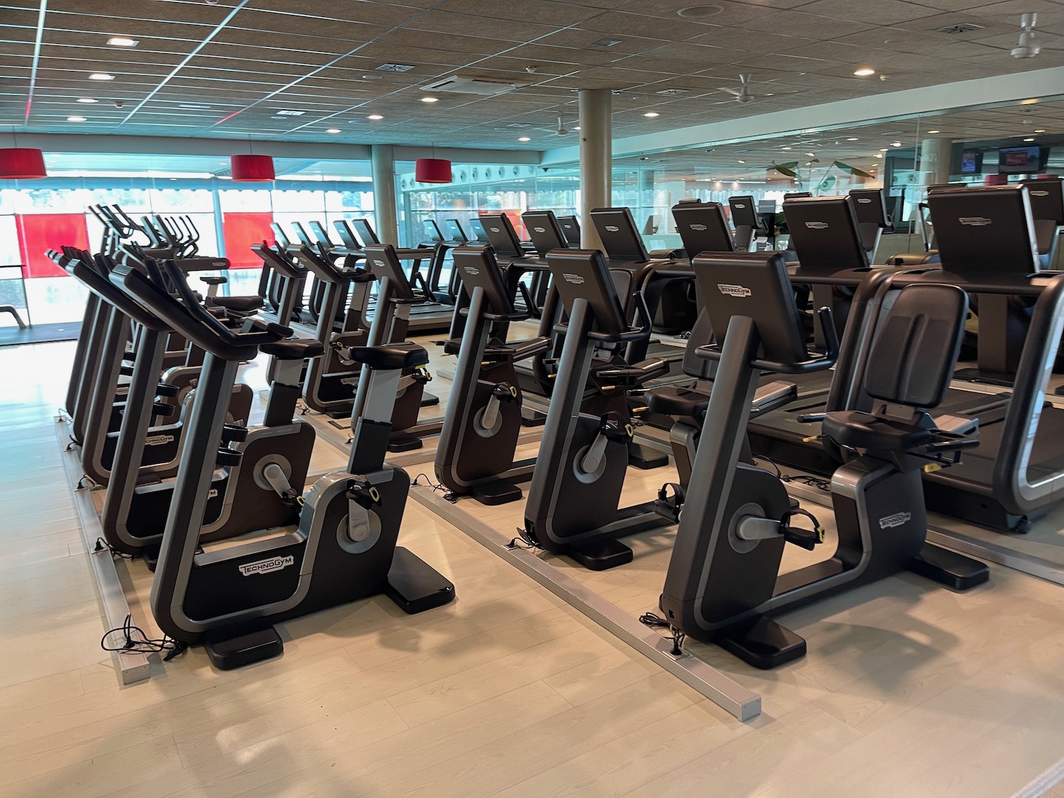 a group of exercise machines in a gym