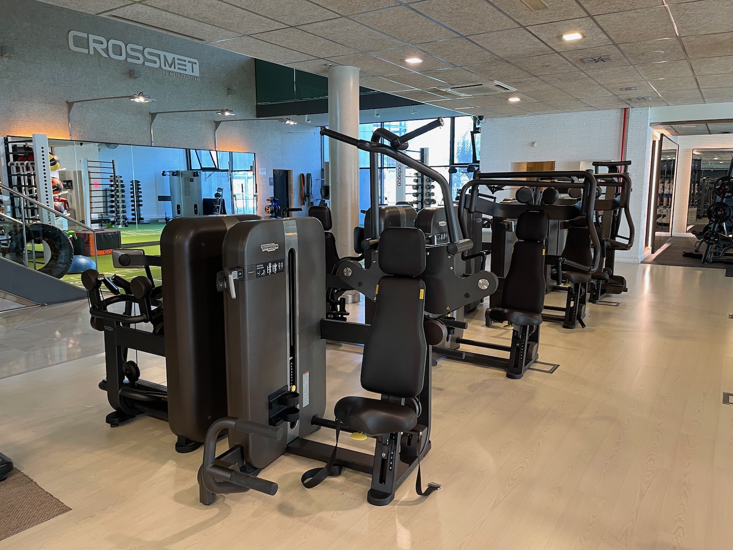 a gym with several exercise equipment