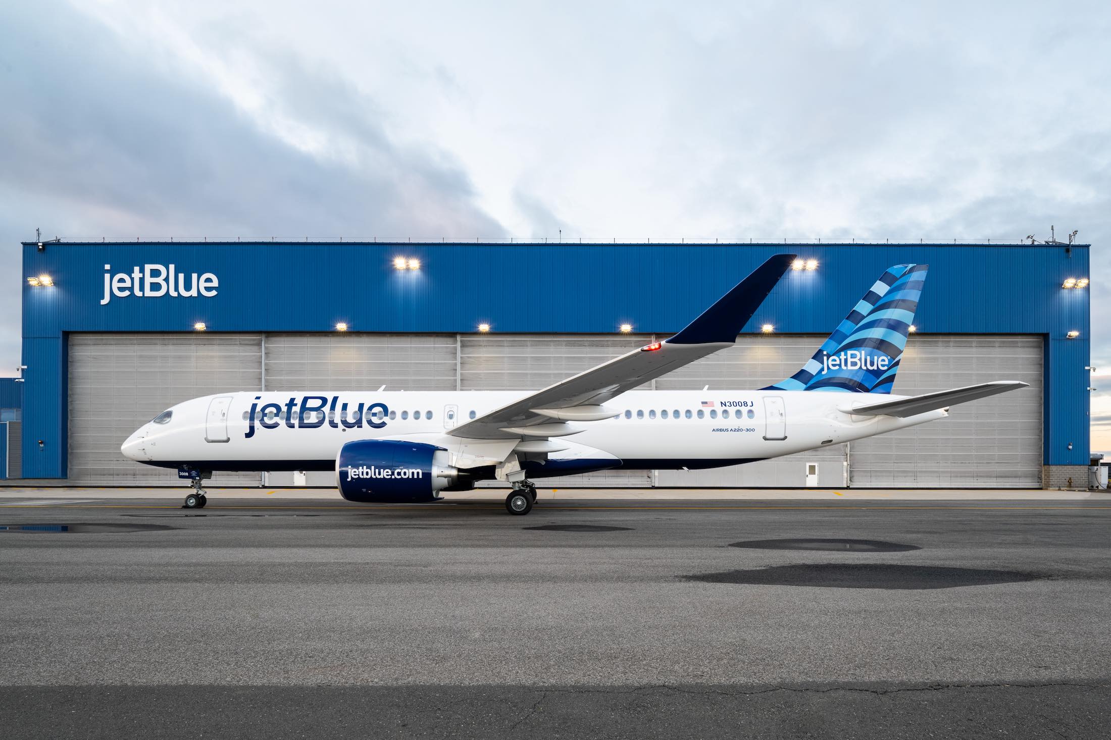 a jet plane parked in front of a building