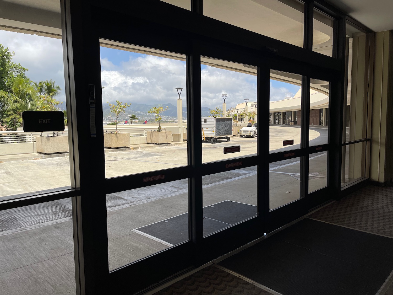 a glass doors with a view of a parking lot