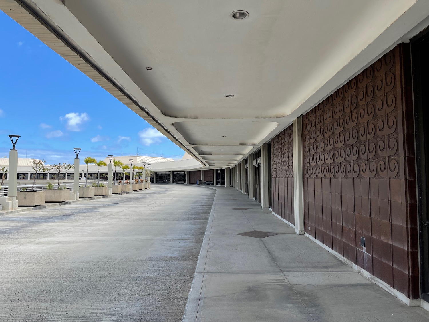 a building with a brown wall and a white ceiling