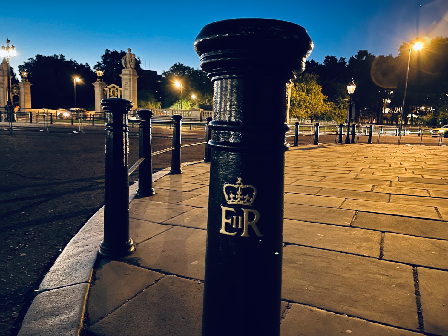 a black post on a sidewalk