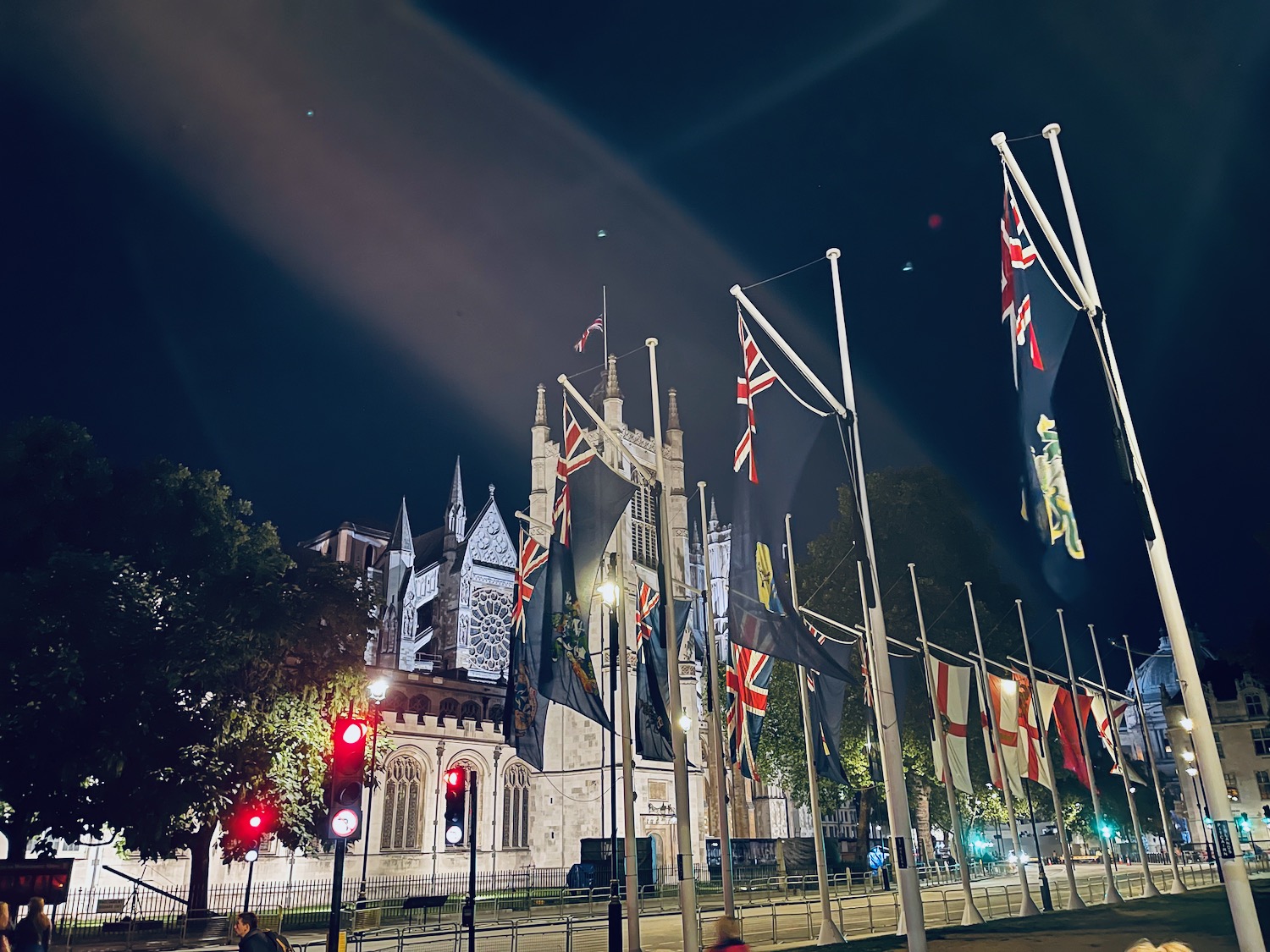 flags on poles in front of a building