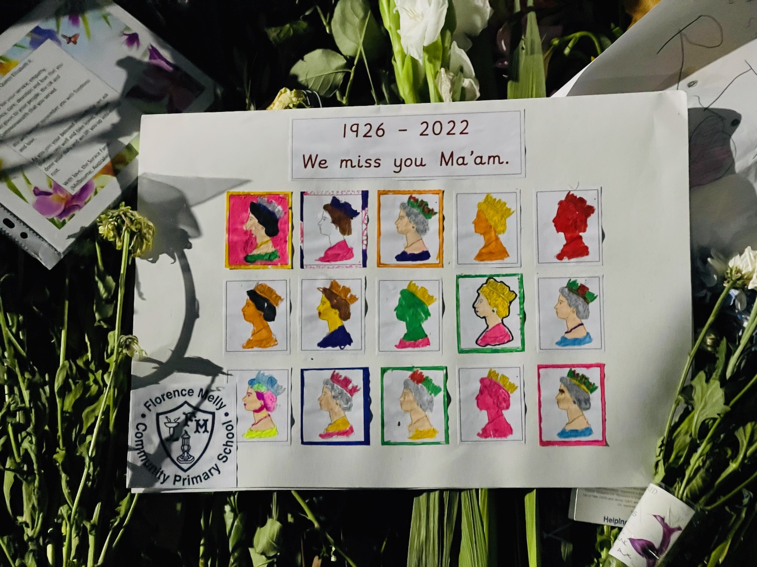a piece of paper with pictures of women's faces and flowers