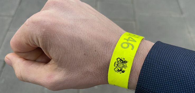 a person wearing a yellow wristband
