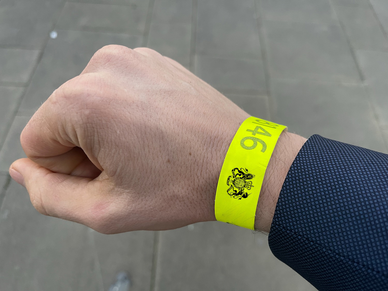 a person wearing a yellow wristband