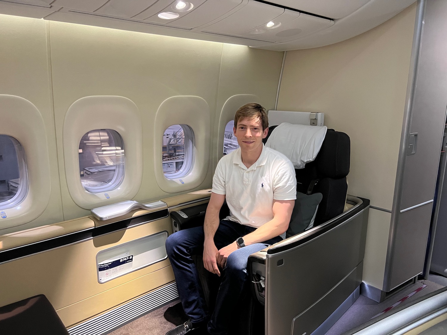 a man sitting in a chair in an airplane