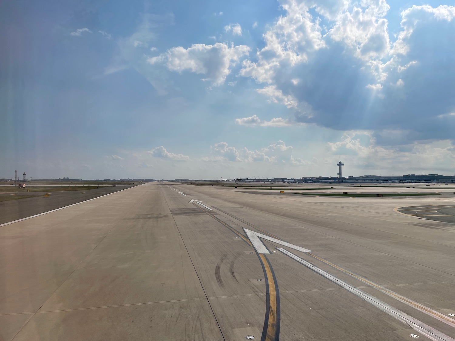 a runway with a cross on the side