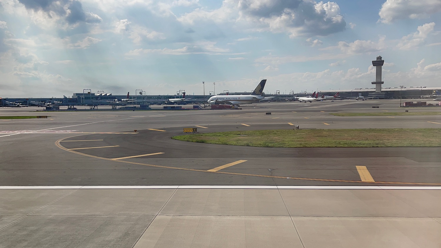 an airport with airplanes on the runway