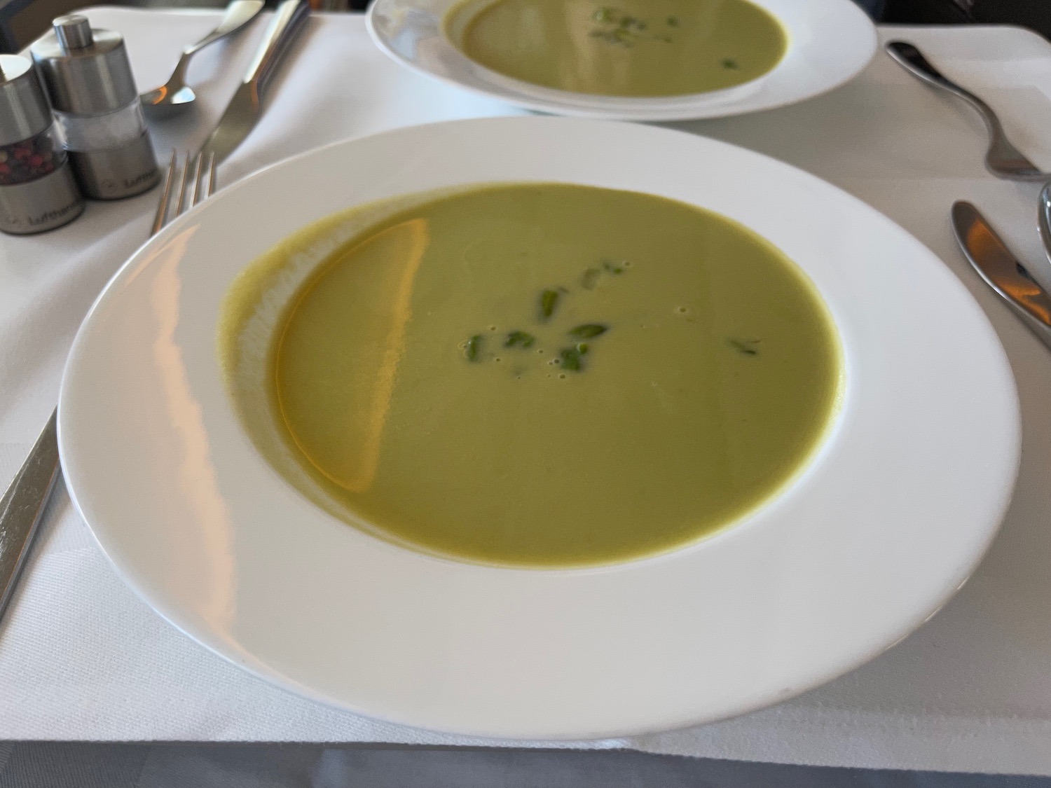 two plates of soup on a table