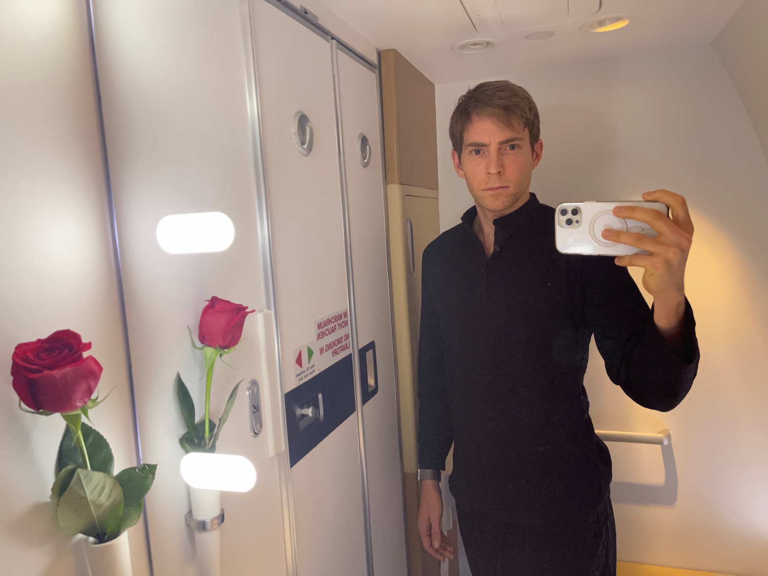 a man taking a selfie in a mirror