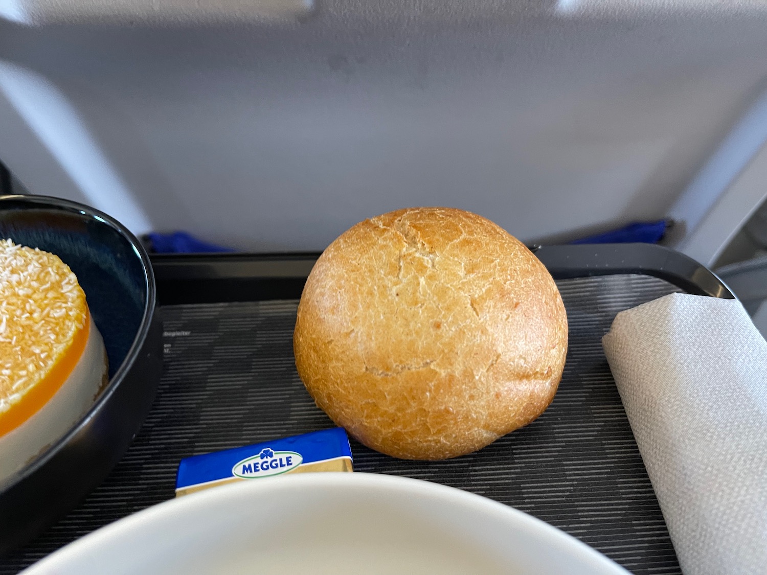 a roll of bread on a tray