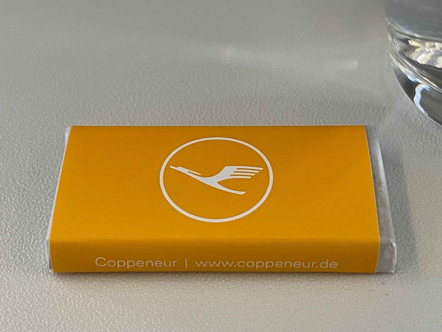 a yellow rectangular object with a logo on it