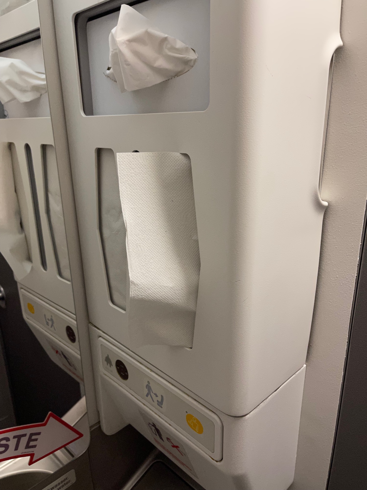 a toilet paper dispenser on a plane