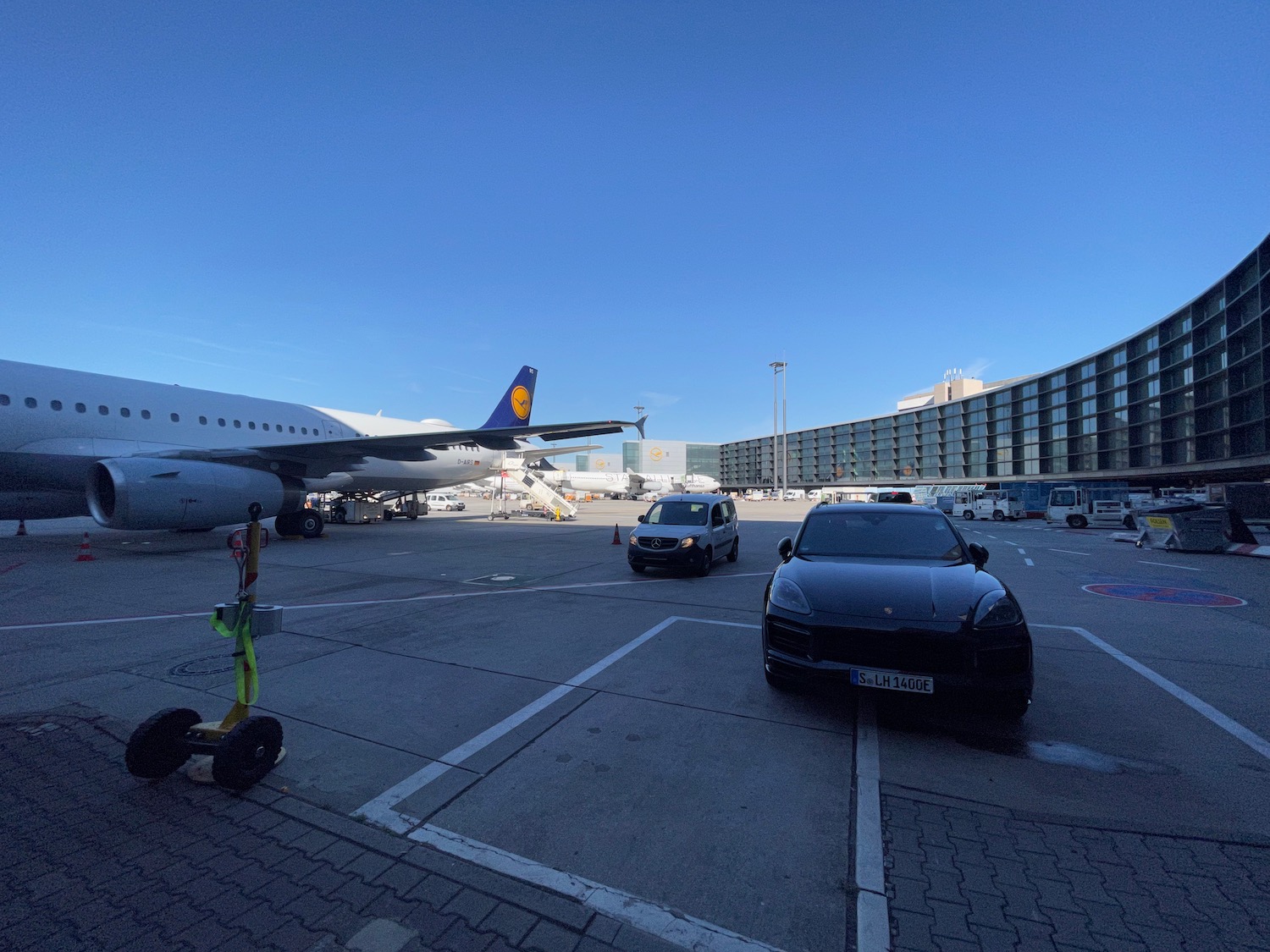 a car and airplane on a runway