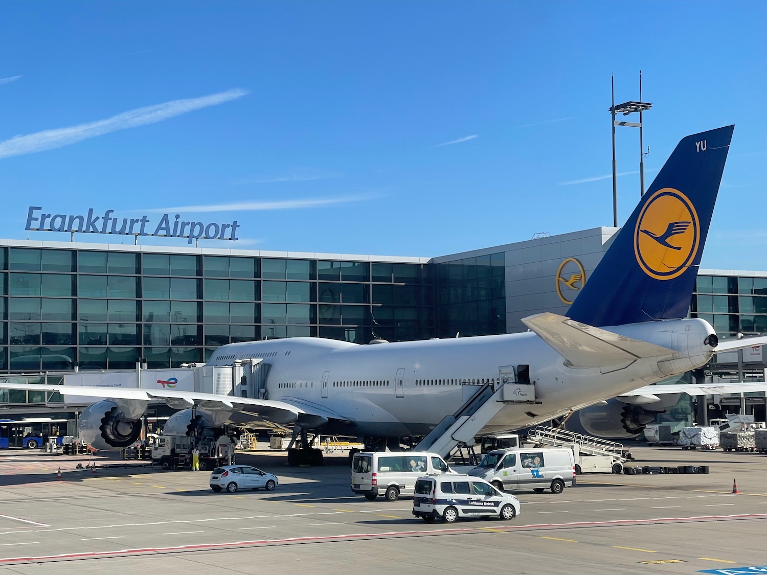 a large airplane parked in front of a building