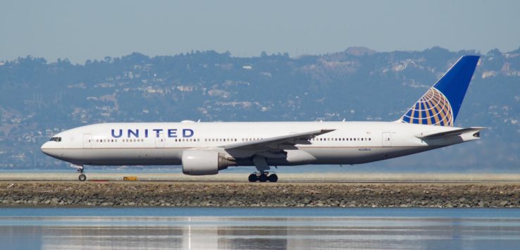 a white airplane on a runway