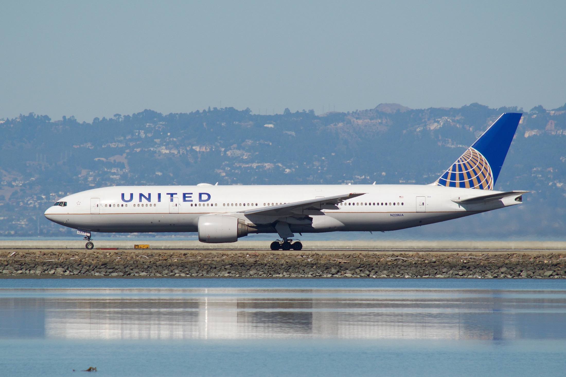 a white airplane on a runway