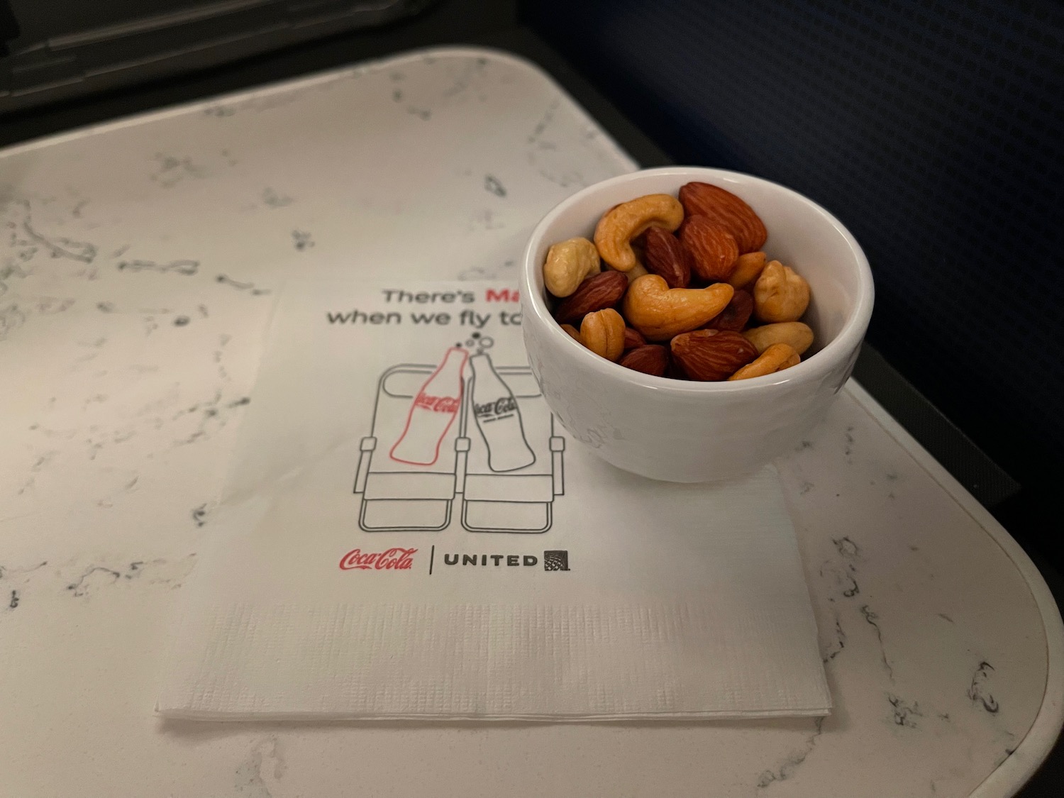 a bowl of nuts on a napkin