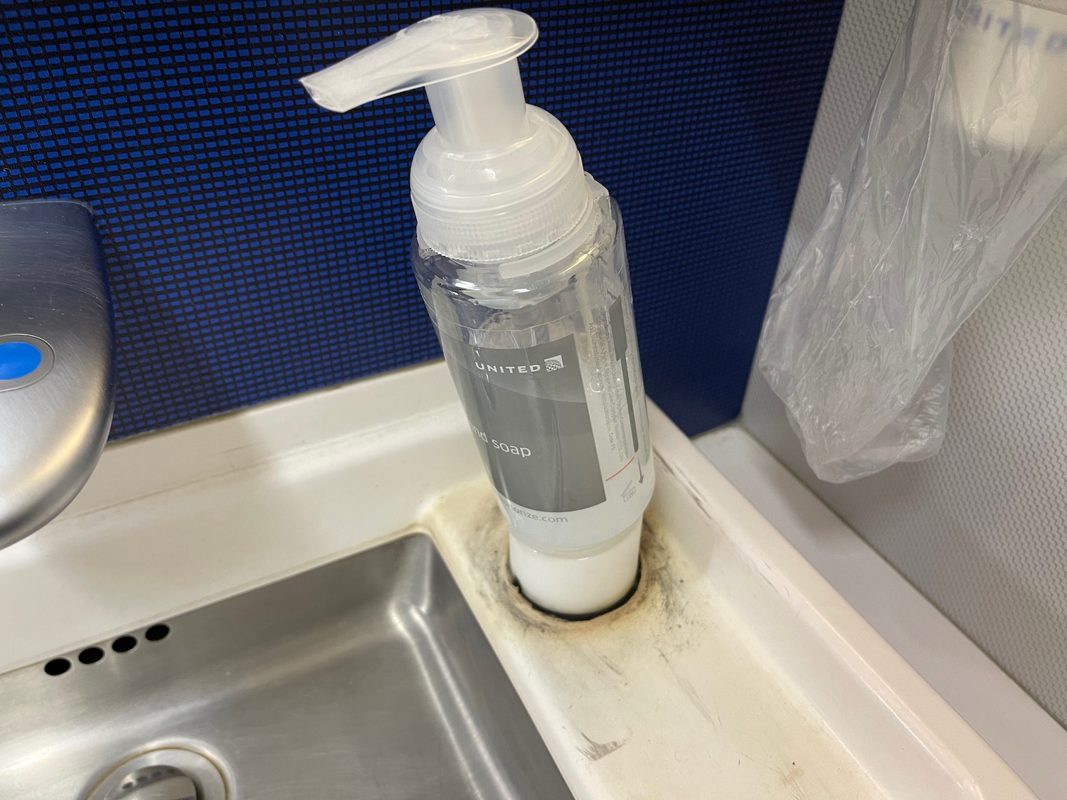 a soap dispenser in a sink