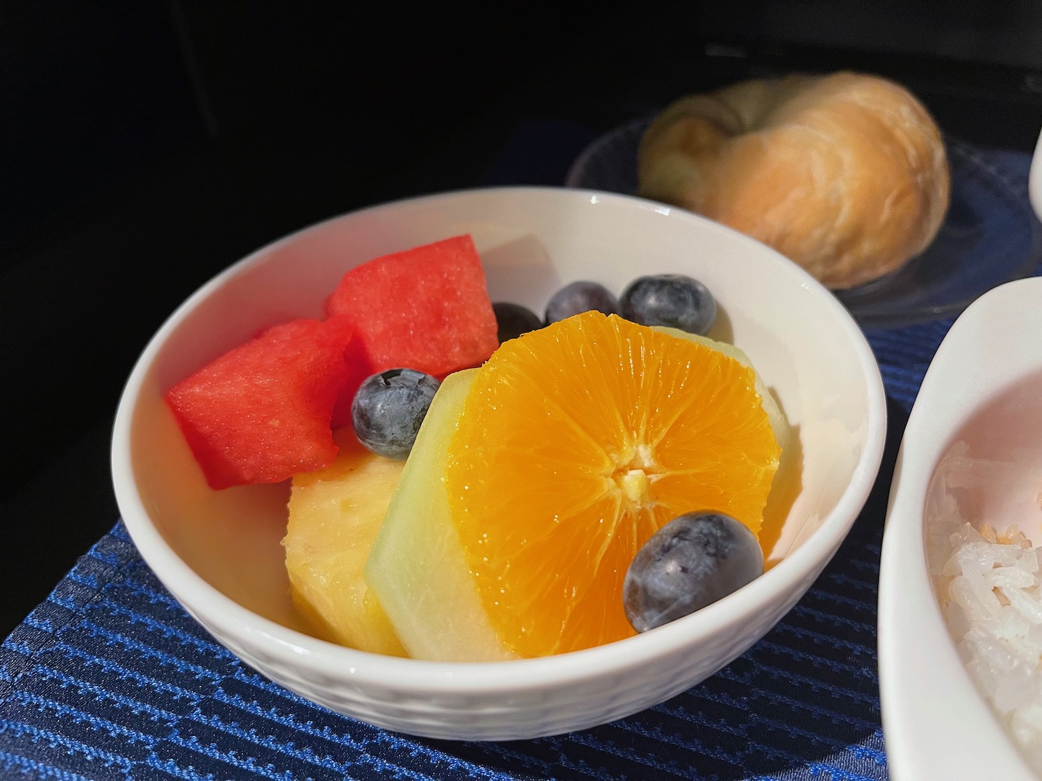 a bowl of fruit on a table