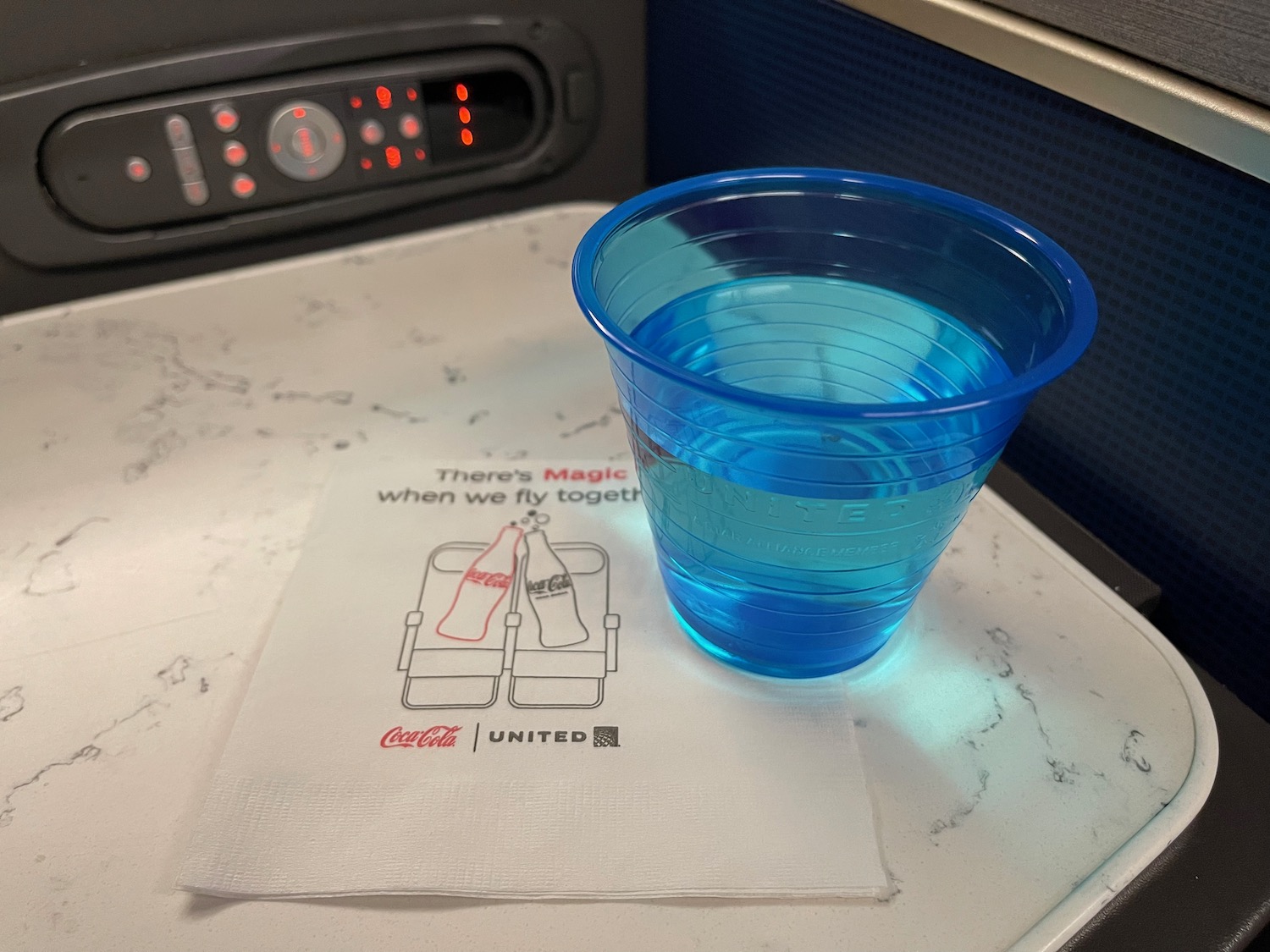 a blue plastic cup on a napkin