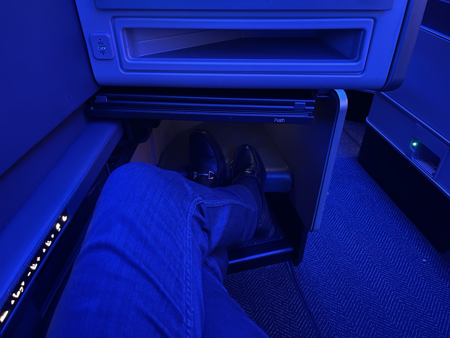 a person's legs in a blue room