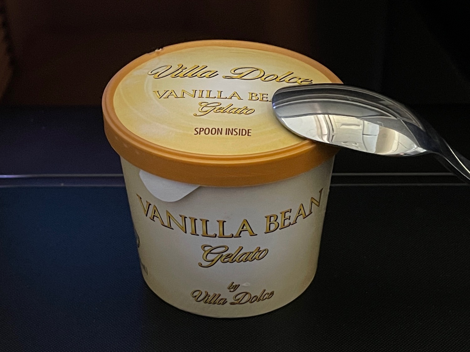 a container of ice cream with a spoon