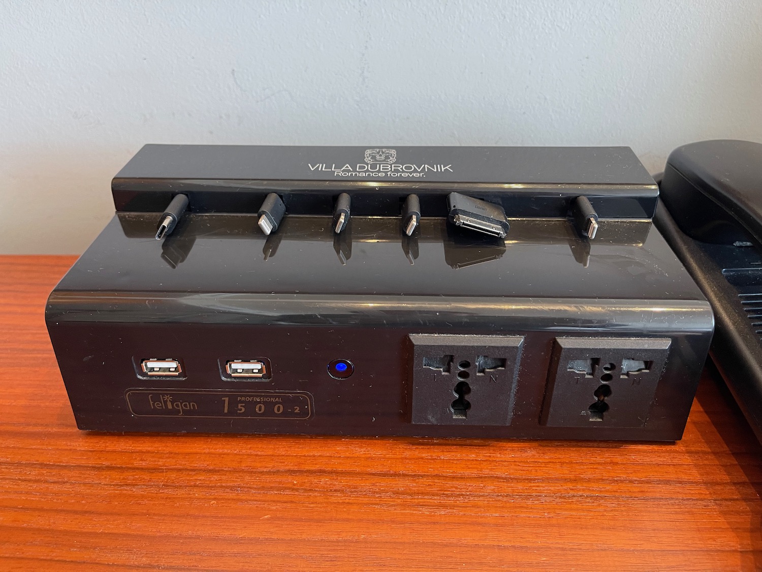 a black power strip with usb ports and plugs