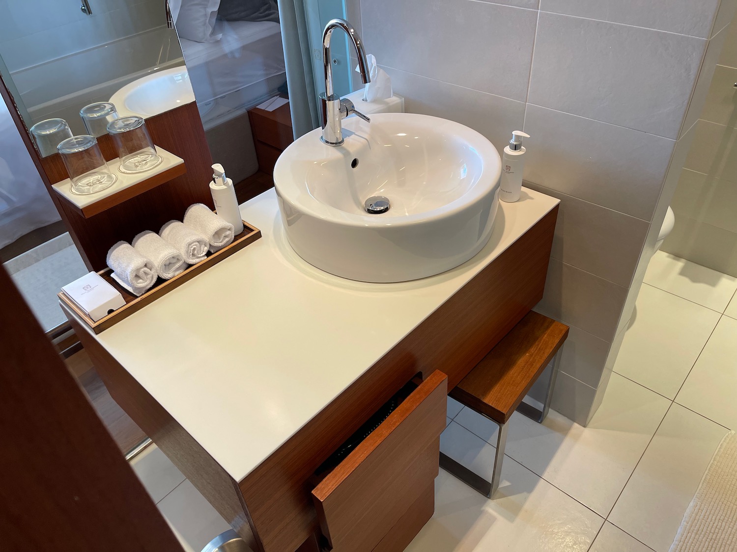 a sink and towels on a counter