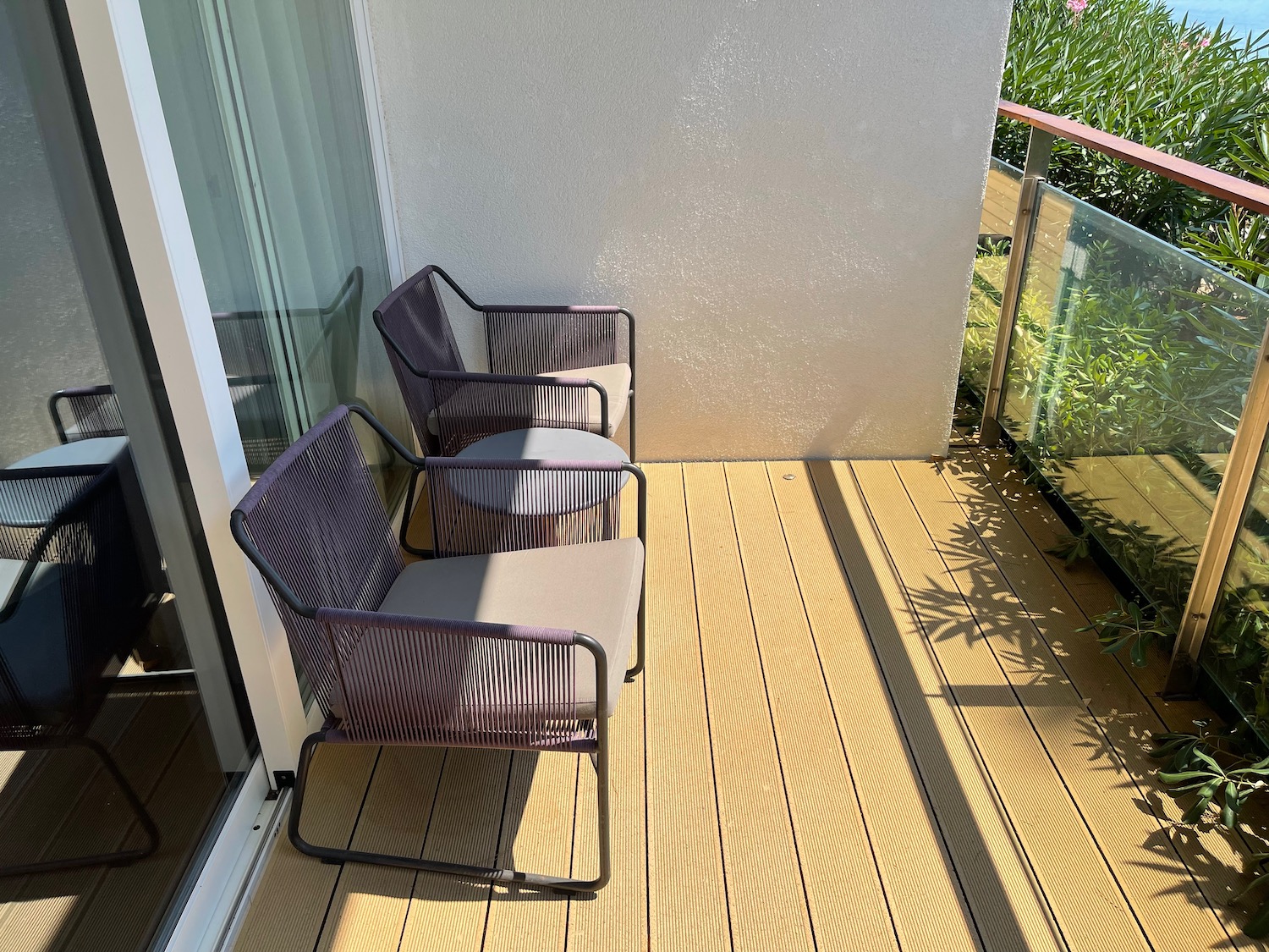 a patio with chairs and a table