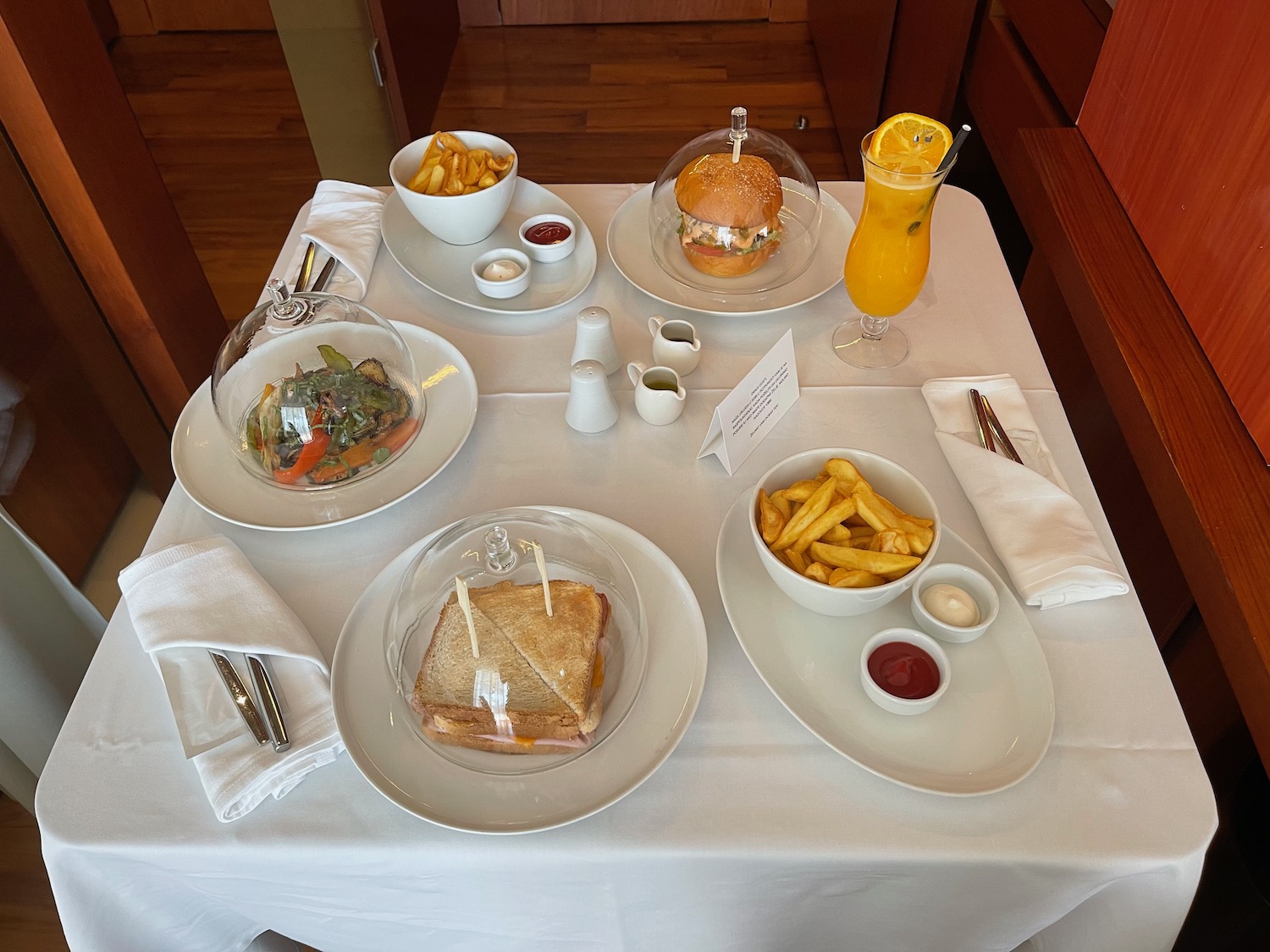 a table with plates of food and drinks