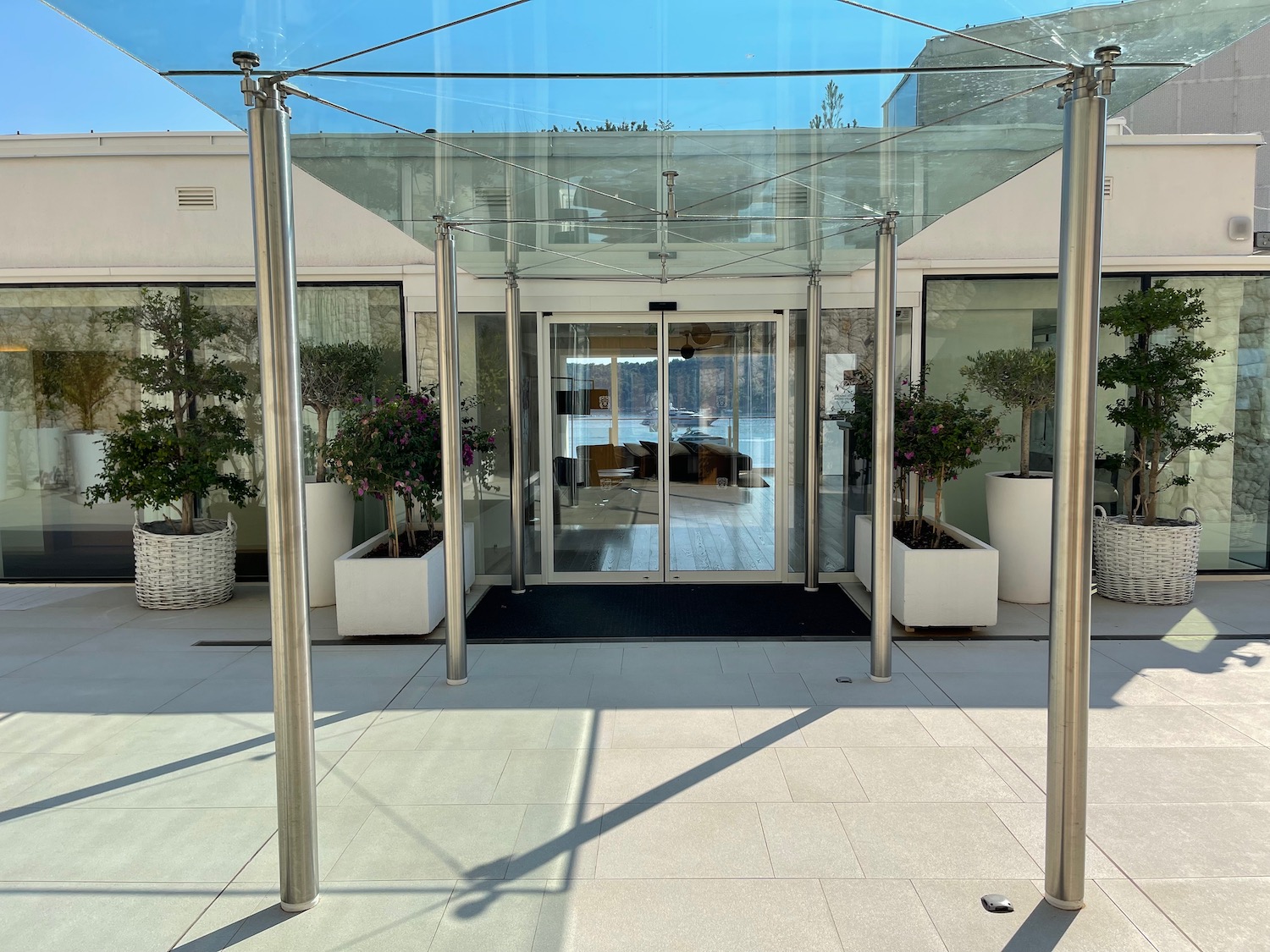 a glass door with a glass roof