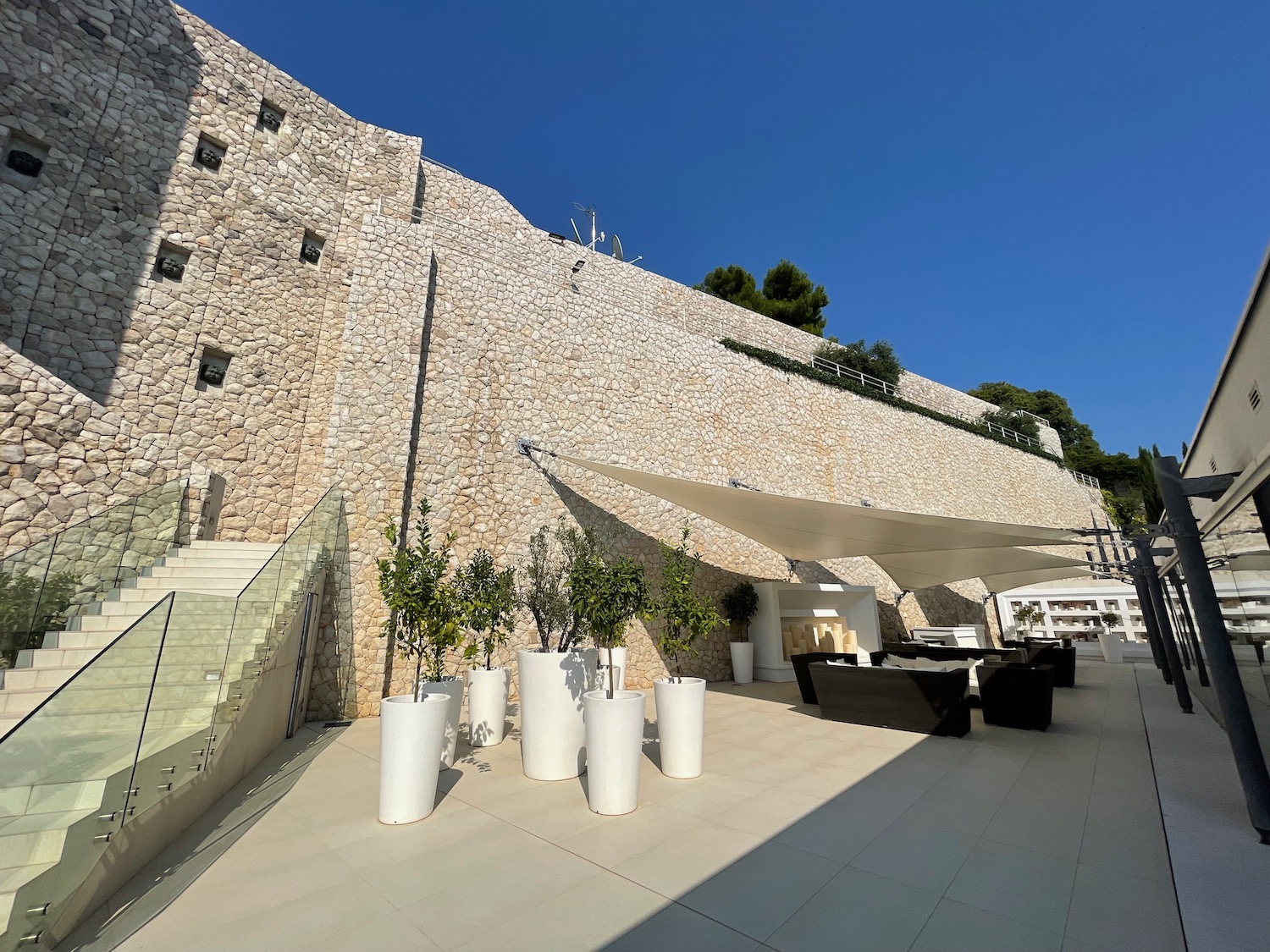 a stone wall with a large building with a large stone wall