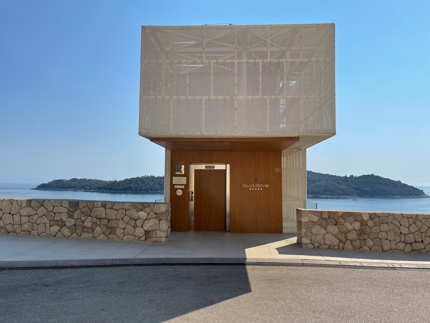 a building with a square door and a stone wall