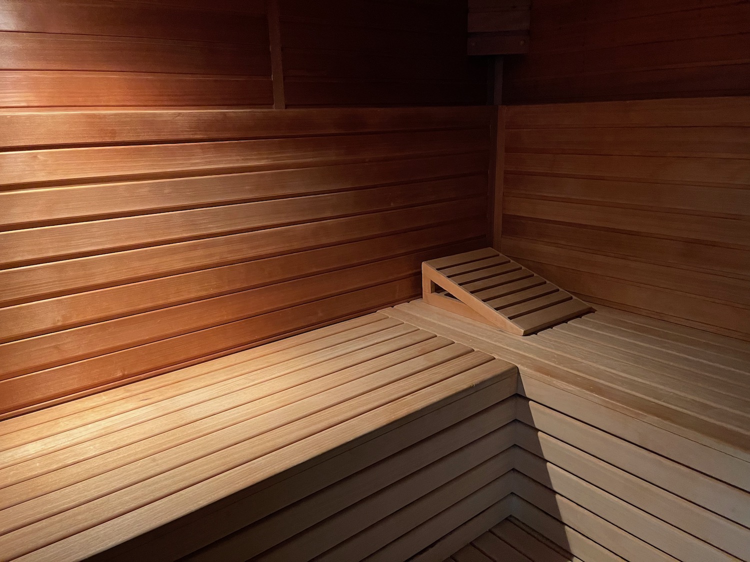 a wooden sauna with a light on