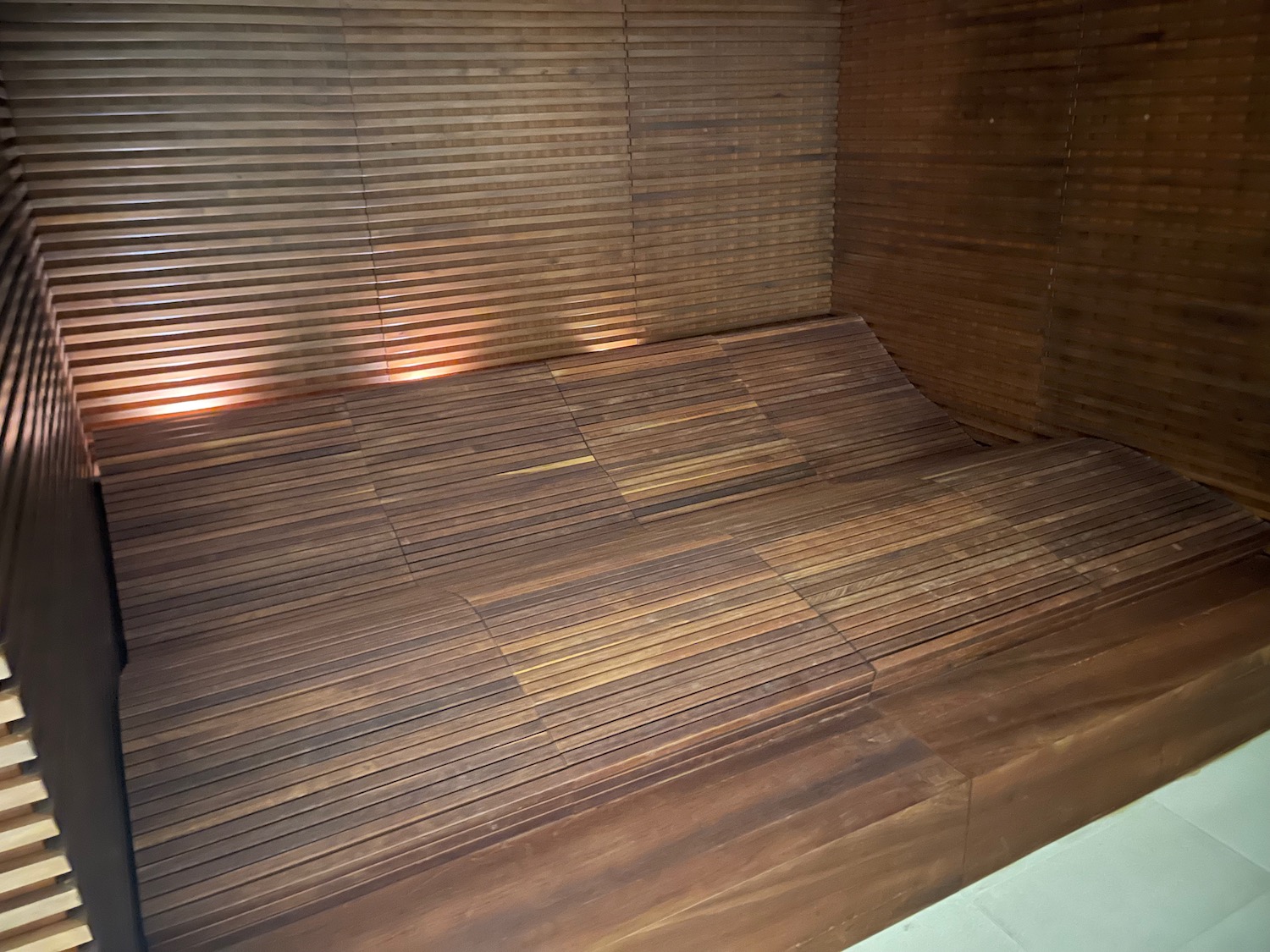 a wooden bench in a room